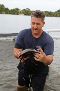 Bryan Fluech holds horseshoe crab