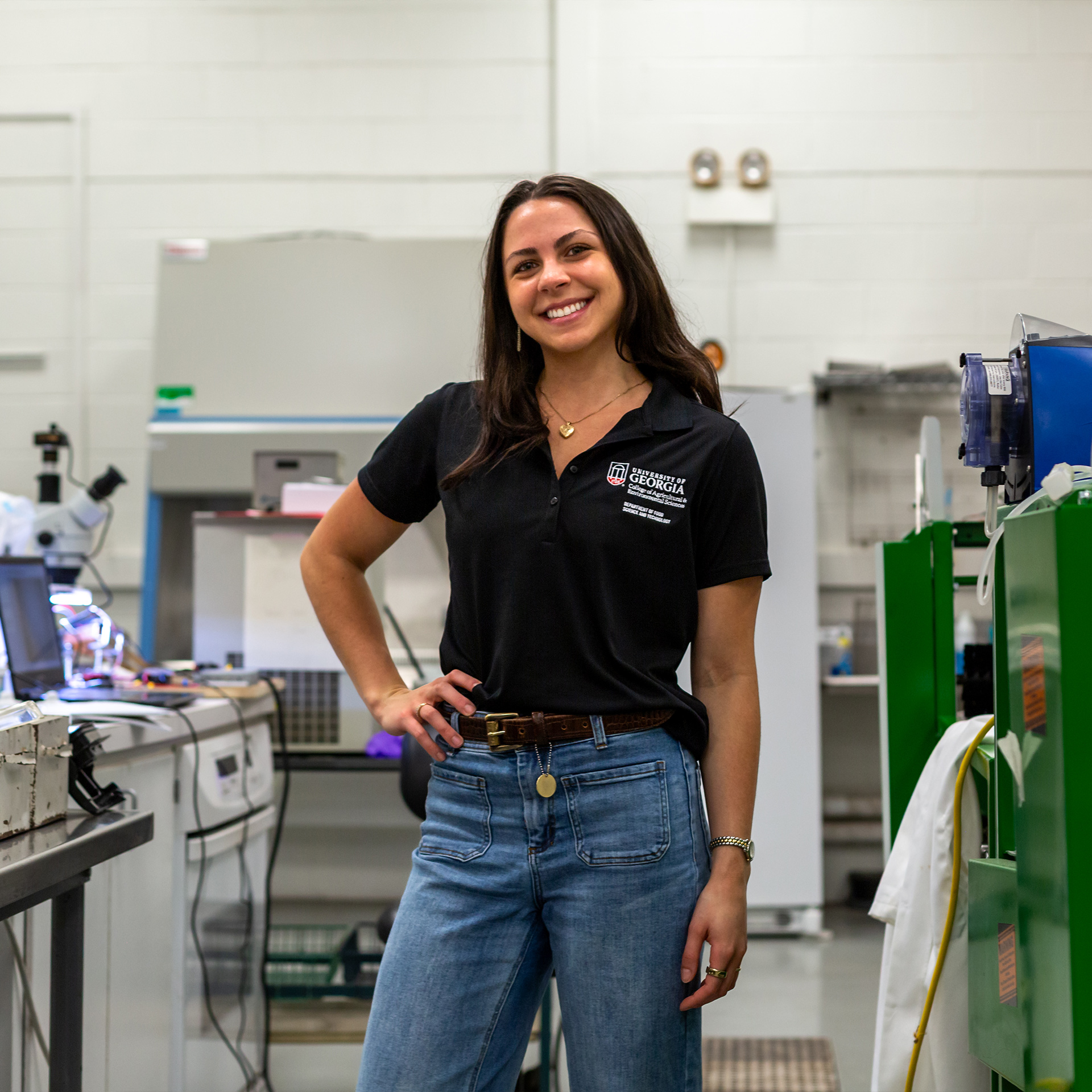 Gina Fimiano stands smiling in a lab setting